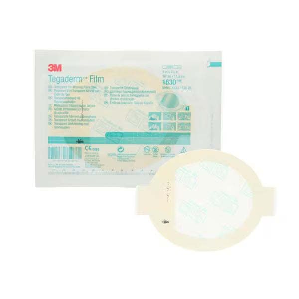 A Tegaderm Film 1630 adhesive patch shown in front of its retail packaging on a plain white background. The packaging is white with teal and red 3M branding, and the round patch has a pale beige adhesive area with a translucent outer edge.