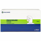 A box of Halyard Procedure Mask, Yellow, containing 50 soft earloops. The packaging is white with a bright green horizontal band and a dark blue lower section, featuring a line drawing of a person wearing a mask.
