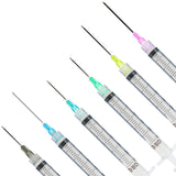 Five BD syringe-style needles with different colored tips (pink, yellow, green, blue, and gray) arranged diagonally on a plain white background.