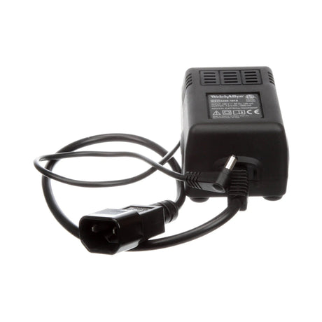 Black power adapter with a plug on a white background